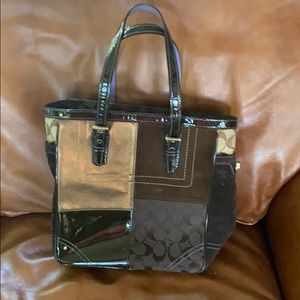 Coach tote handbag with various materials.